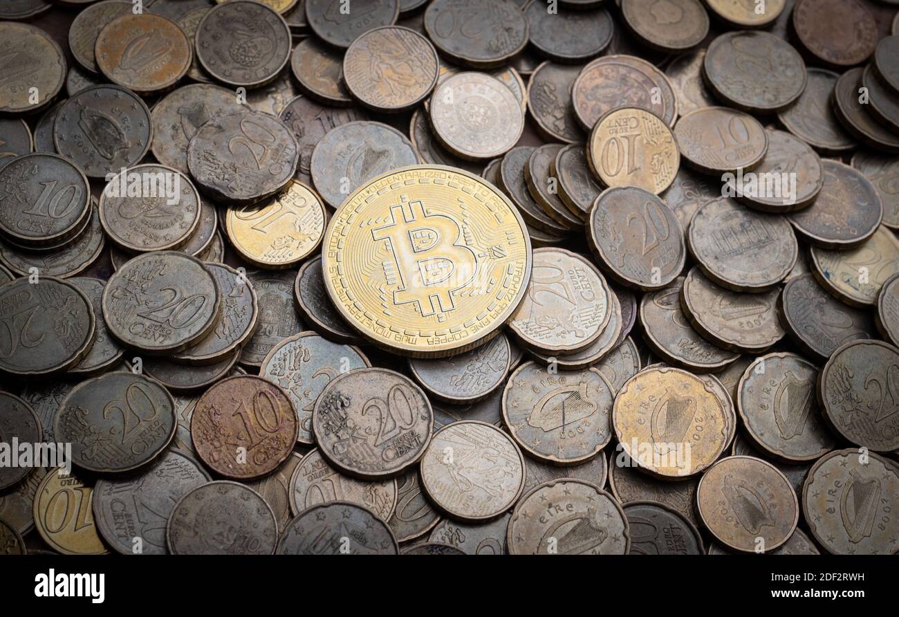 Bitcoin token top of pile of euro coins. Stock Photo