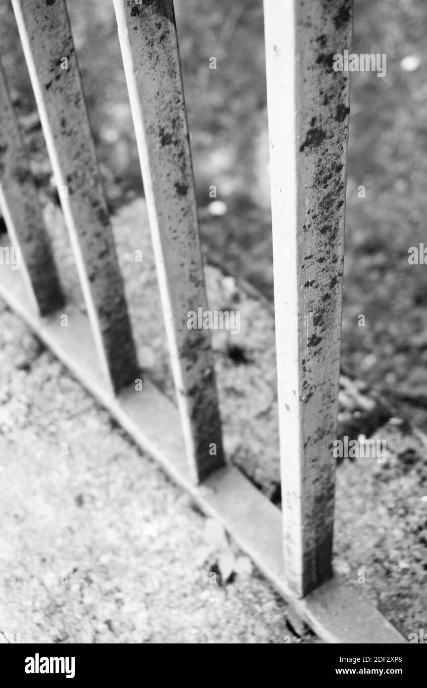 A vertical shot of a metal fence on the ground Stock Photo - Alamy