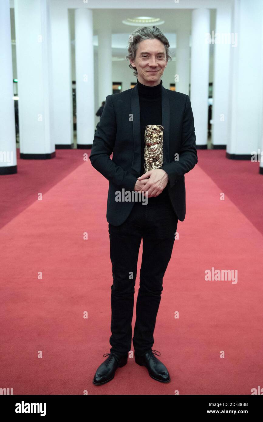 Swann Arlaud poses with the Best Actor in a Supporting Role Award for ...