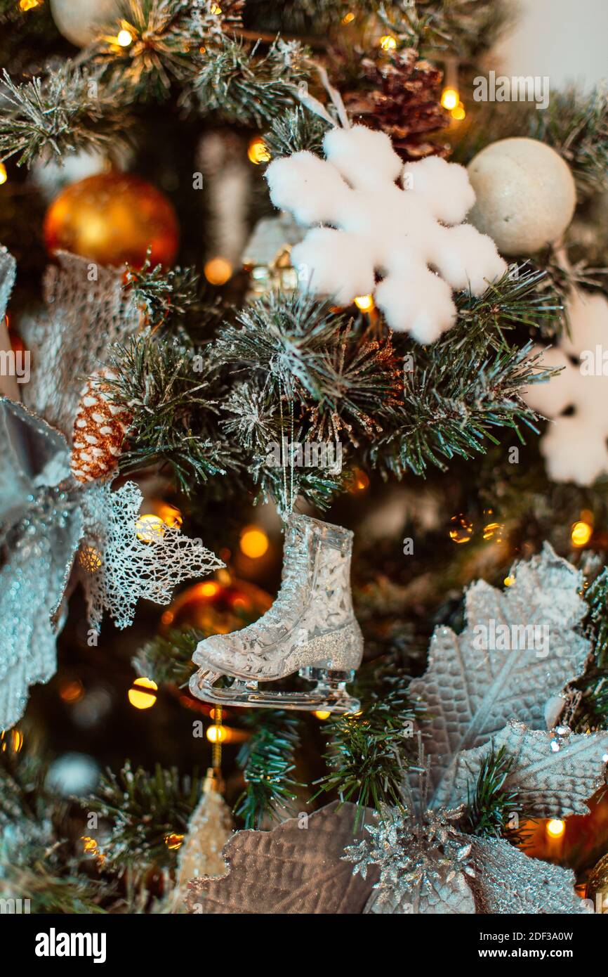 Christmas tree decorated with balls and other decorations close up ...