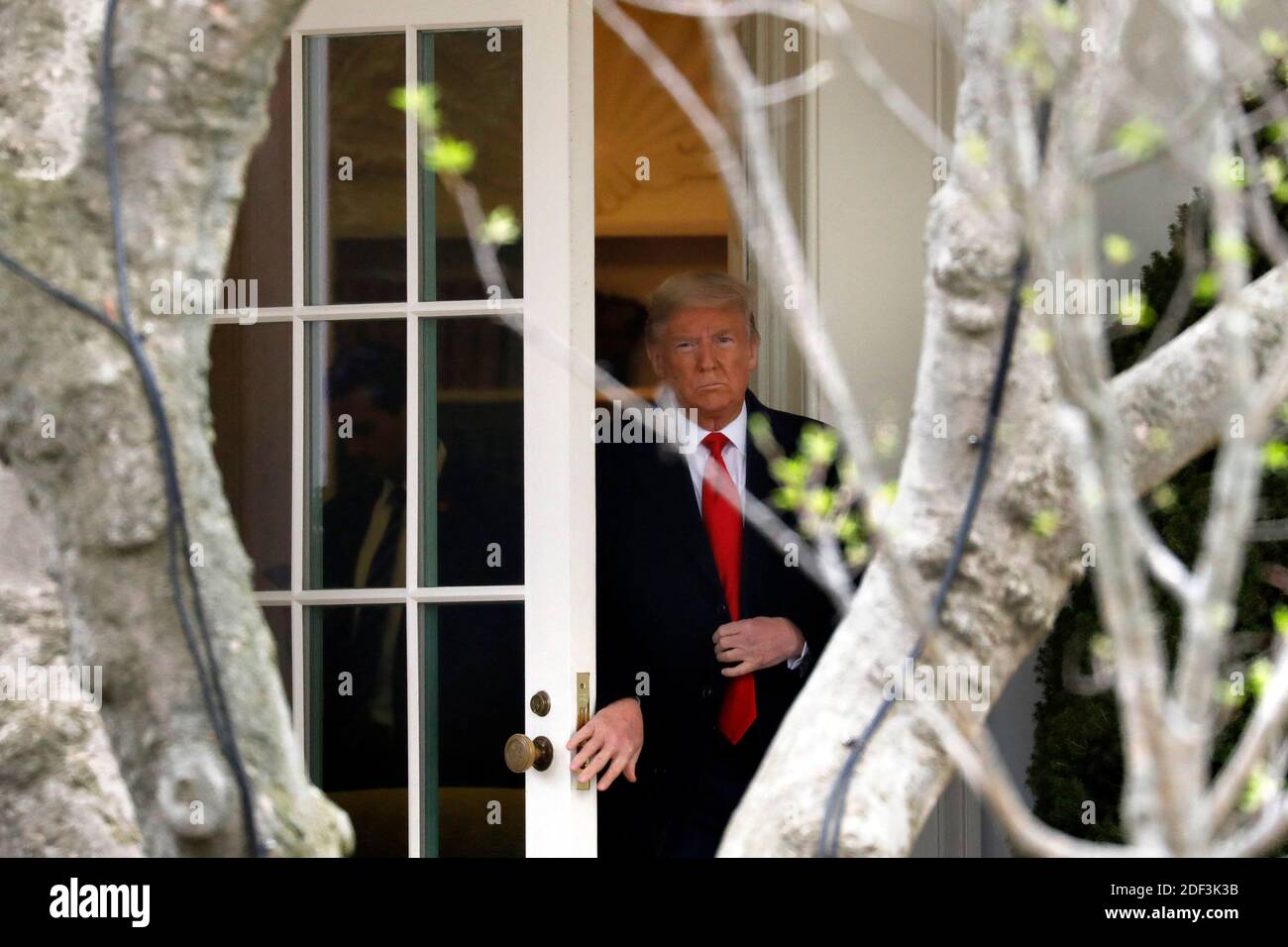 U.S. President Donald Trump walks out from the Oval Office of the White ...