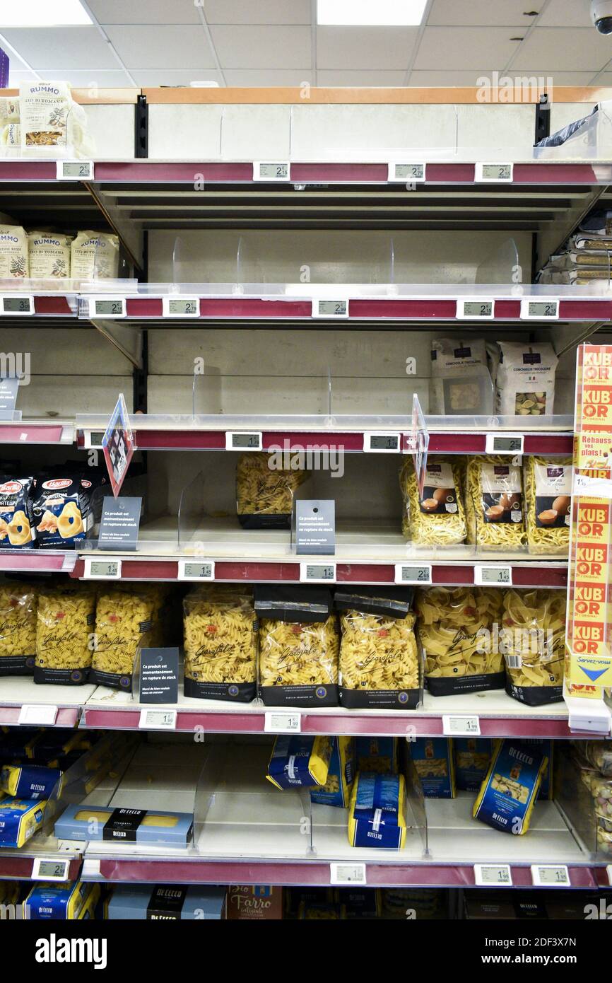 A half-empty shelf, usually stocked with pasta, is seen at a supermarket in Paris, France, on March 13, 2020. Fears about the coronavirus COVID-19 triggered shopping for several products, including hand sanitizers and face masks. Monoprix, Paris, Photo by Magali Cohen/ABACAPRESS.COM Stock Photo