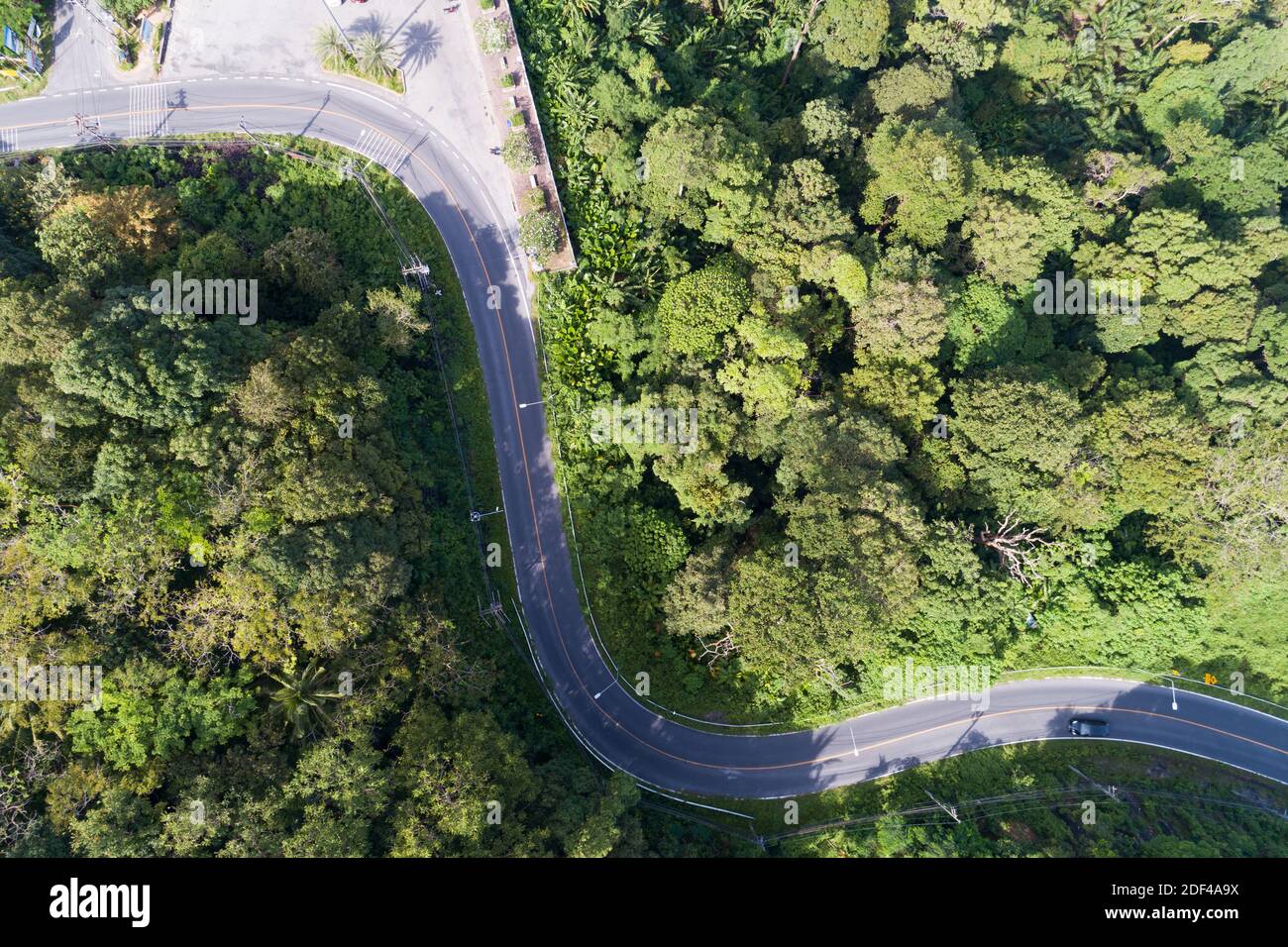 Aerial view drone shot top view of Asphalt road curve on mountain ...