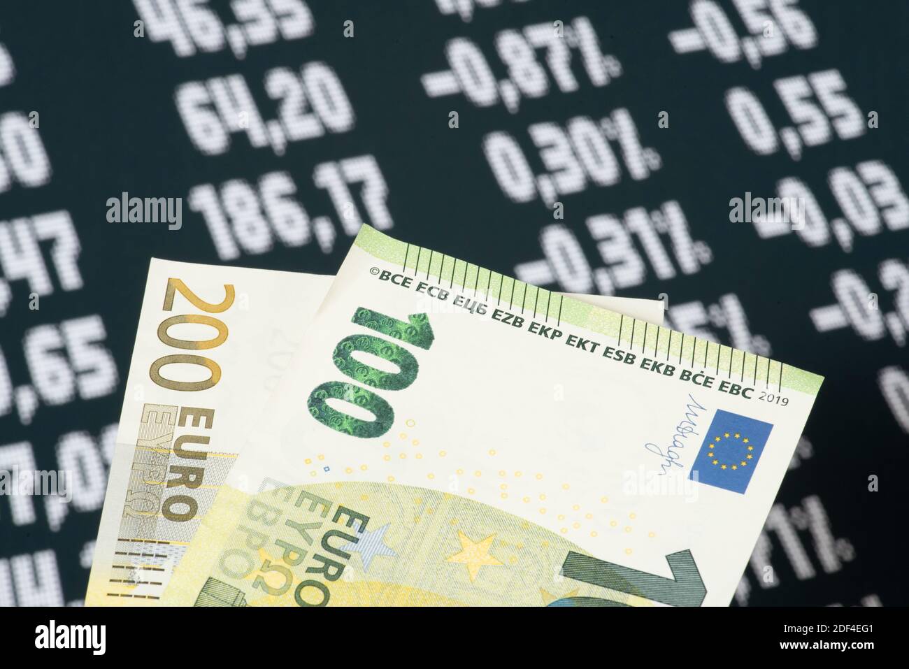 Euro banknotes and price board on the stock exchange Stock Photo