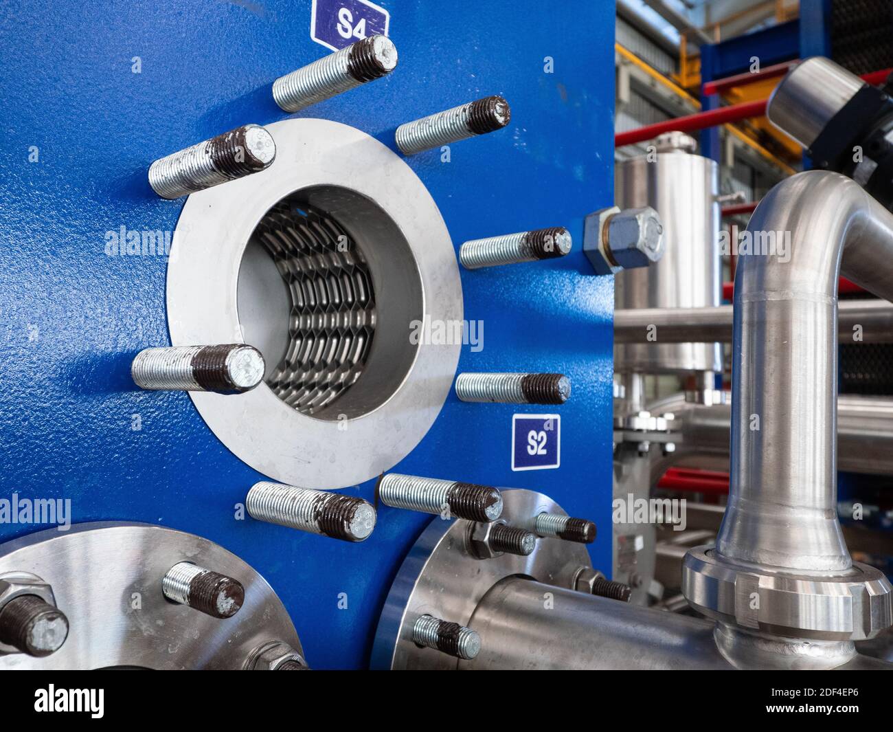 Front plate of plate heat exchanger with some piping removed. Stock Photo