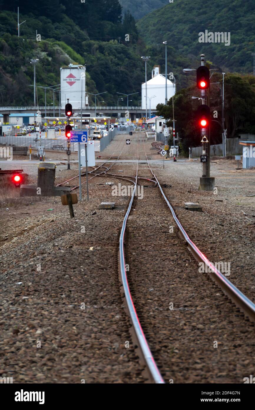 Railway line and red signals, Picton, Marlborough, South Island, New Zealand Stock Photo