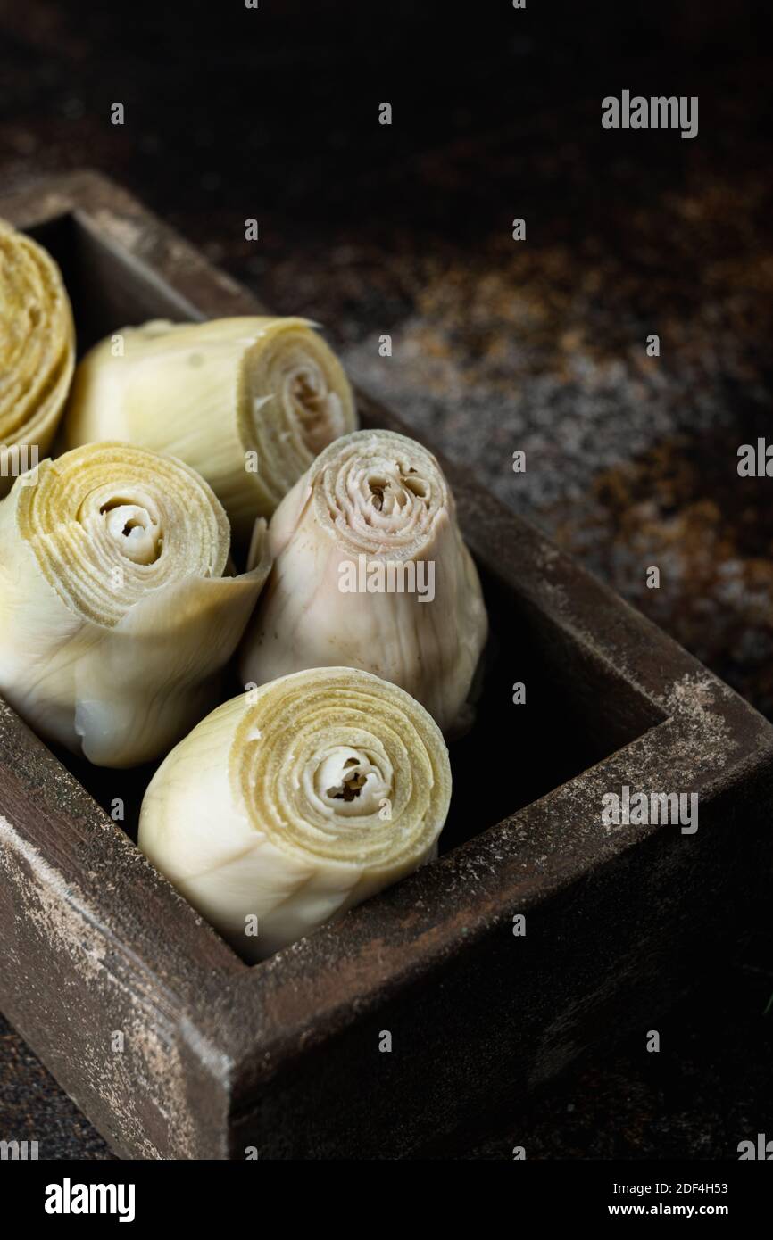 Artichoke hearts marinated with olive oil, on old rustic background Stock Photo Alamy