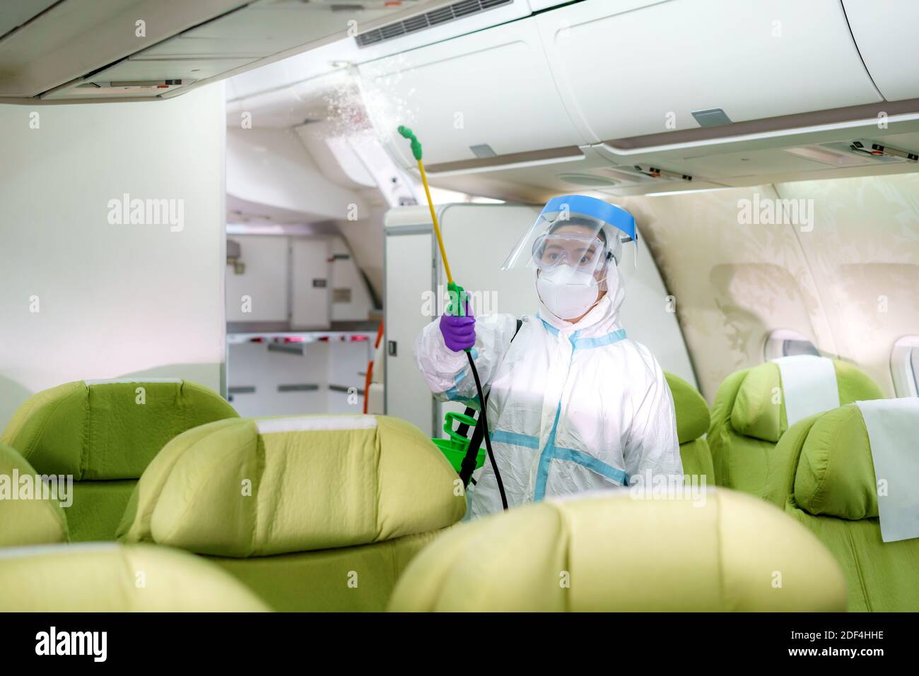 Airline woman staff in Protective suit (PPE) wearing medical face mask