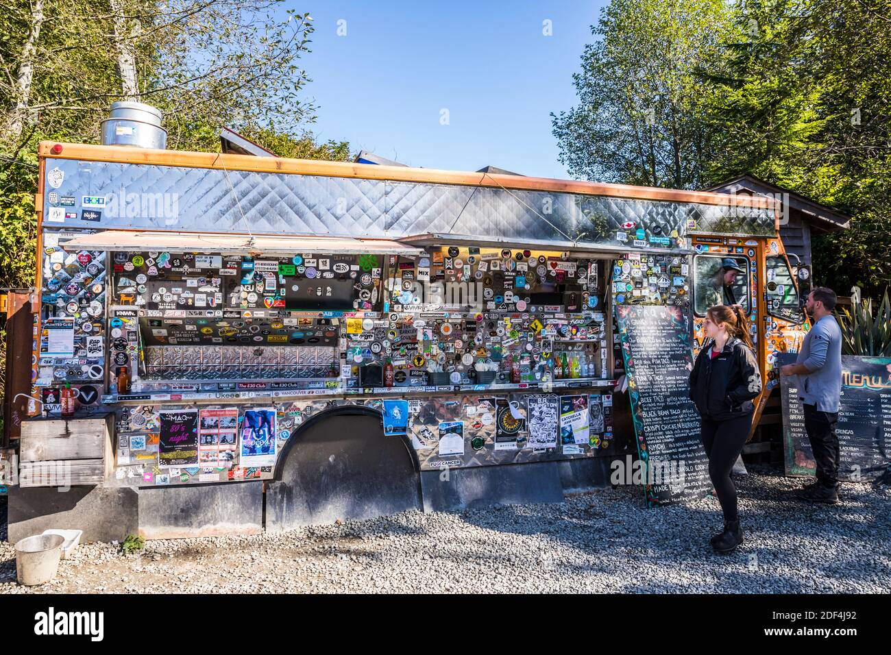 People placing orders at the famous taco truck, Tacofino in Tofino, BC, Canada. Stock Photo