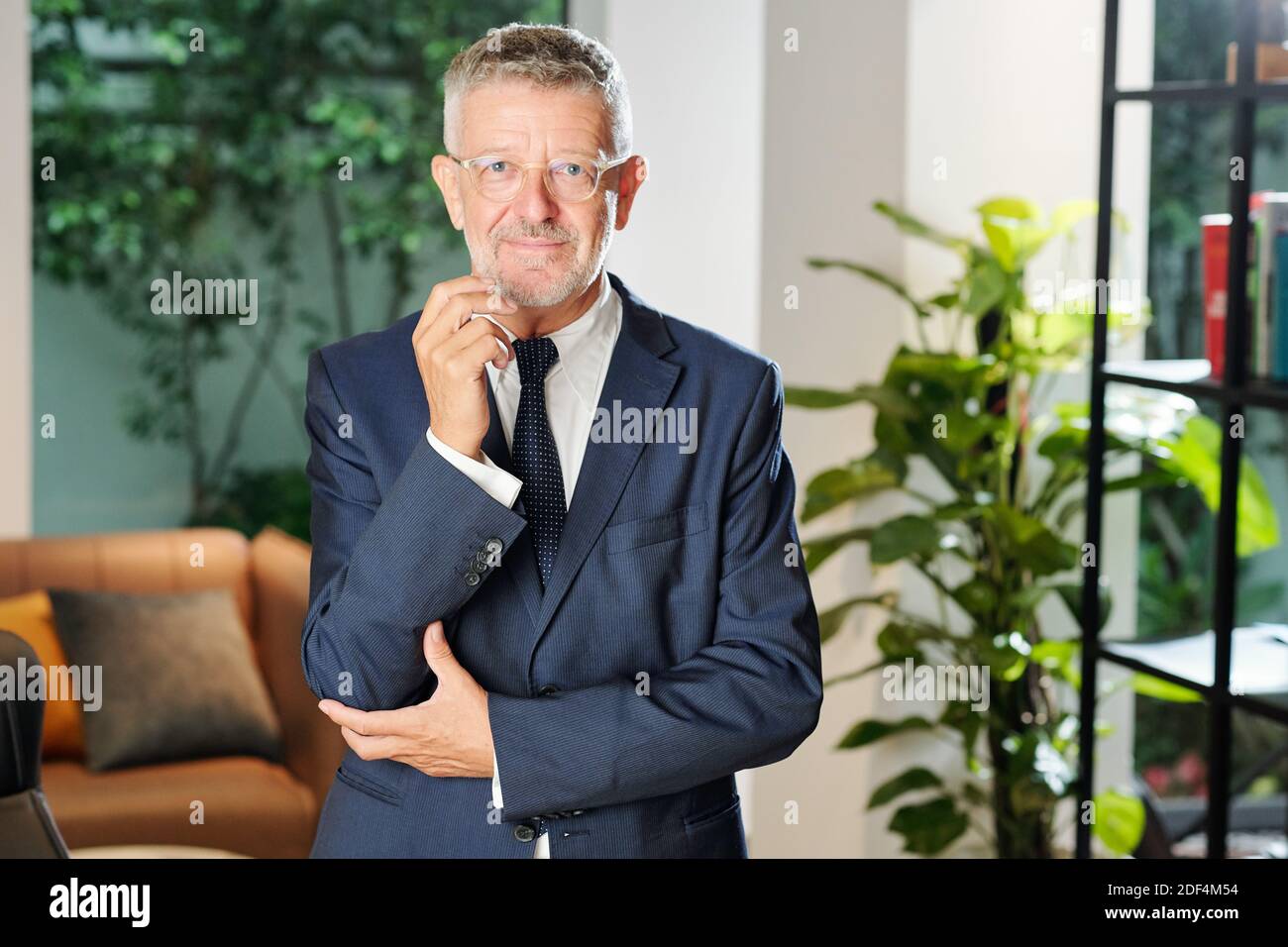 Smiling middle-aged entrepreneur Stock Photo