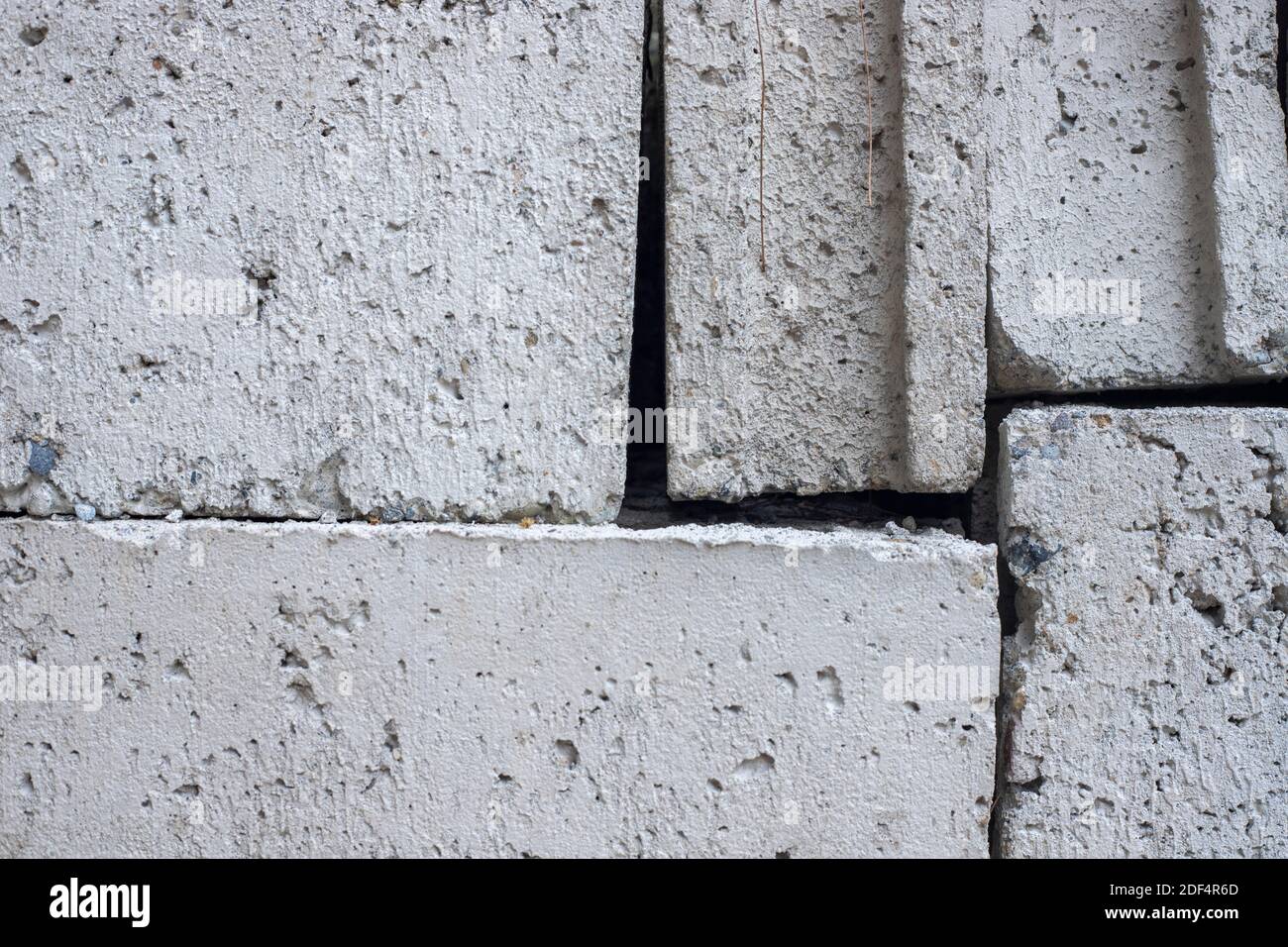 White concrete bricks closeup photo texture. Concrete block surface. Rough grey stone brick. Masonry wall made of big block. Rustic stone texture. Ind Stock Photo