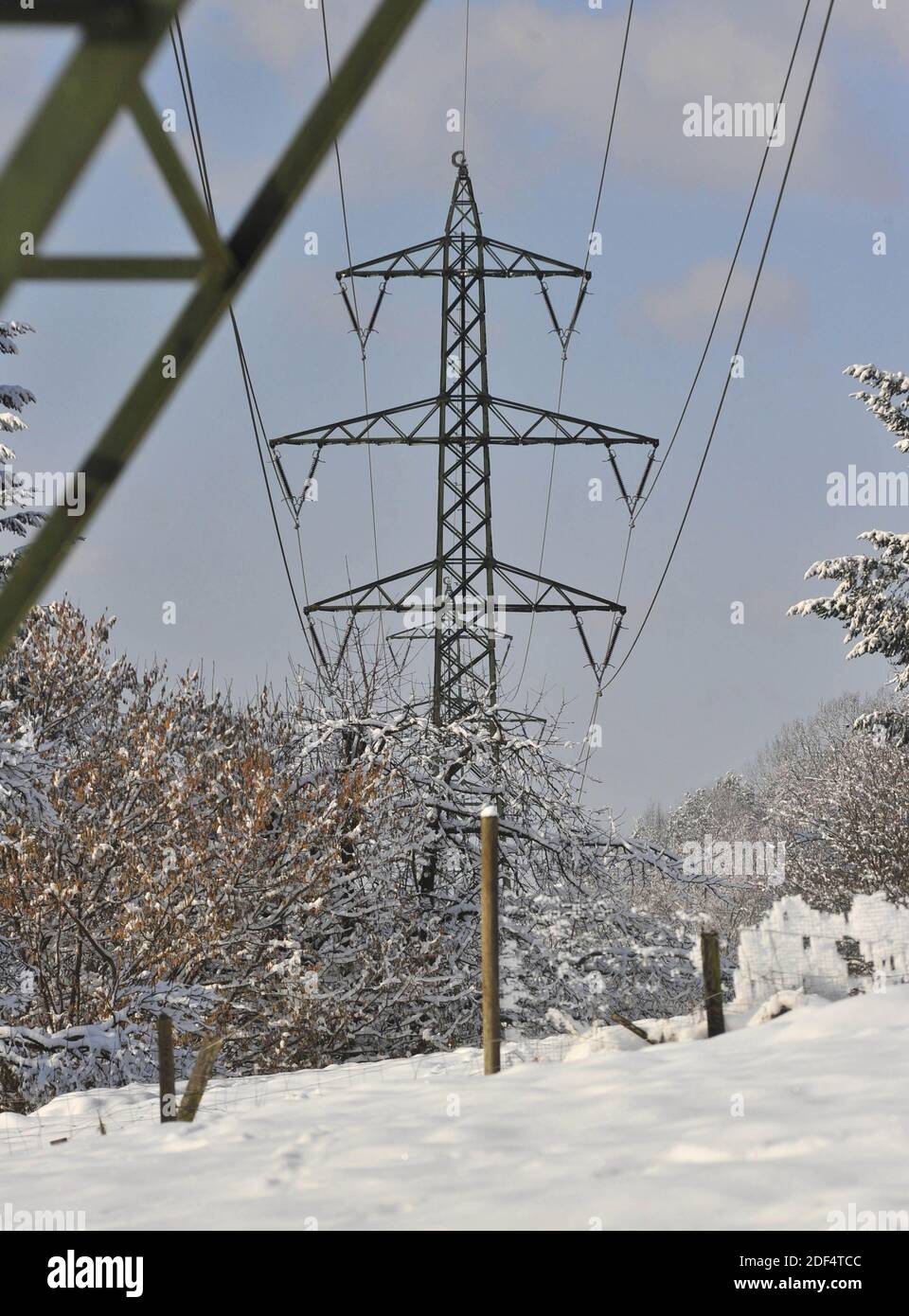 High voltage line in the alps in winter, snowy landscape Stock Photo ...