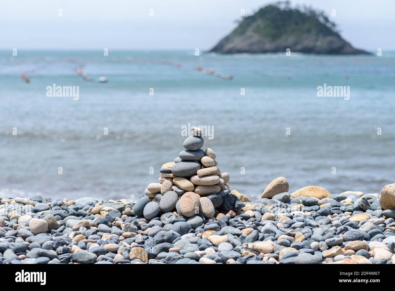 Pebble tower standing on the beach Stock Photo