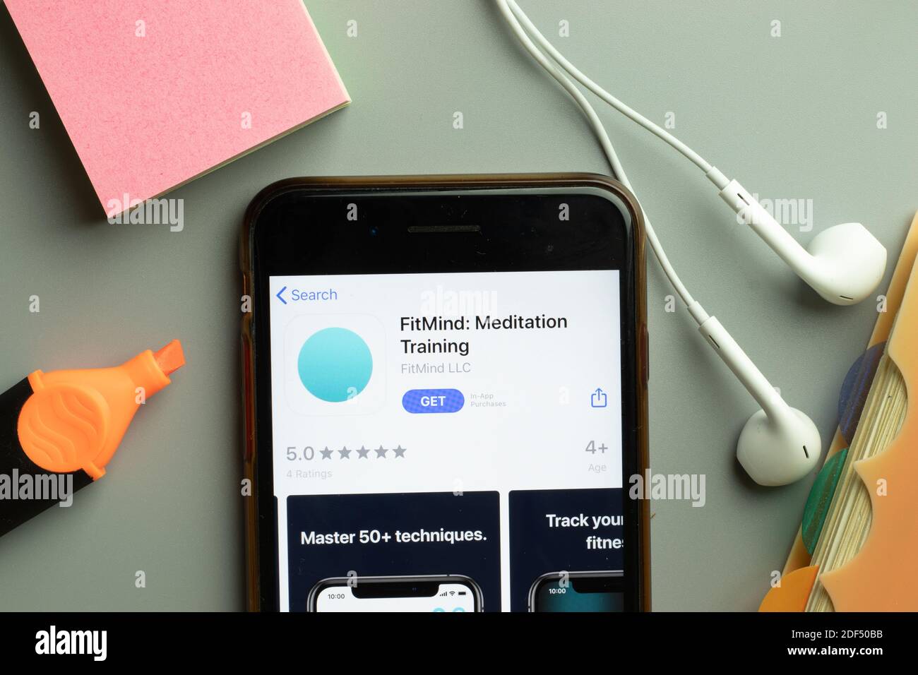 New York, USA - 1 December 2020: FitMind Meditation Training mobile app icon on phone screen top view, Illustrative Editorial. Stock Photo