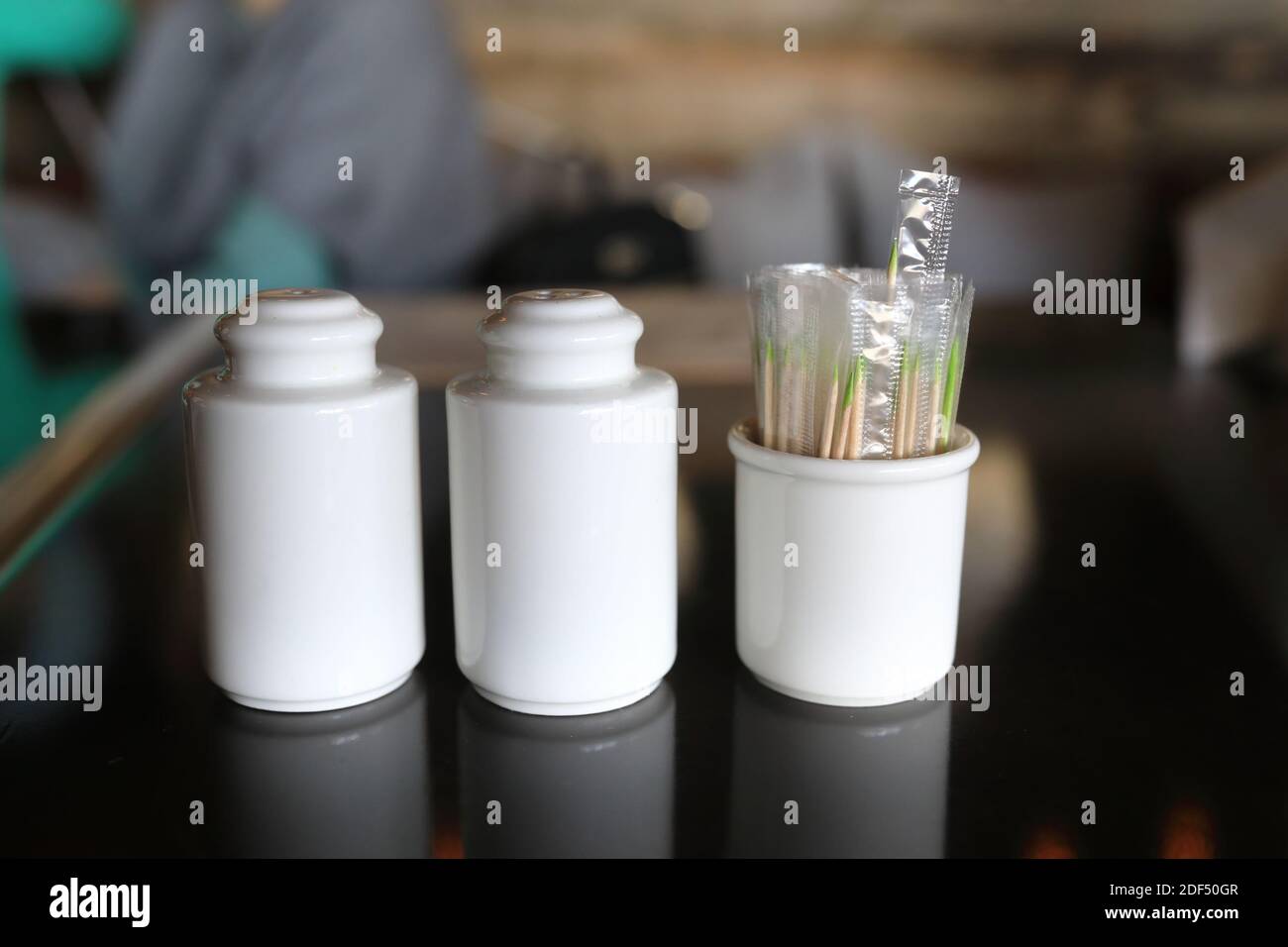 Salt shaker with pepper and toothpicks in restaurant Stock Photo Alamy