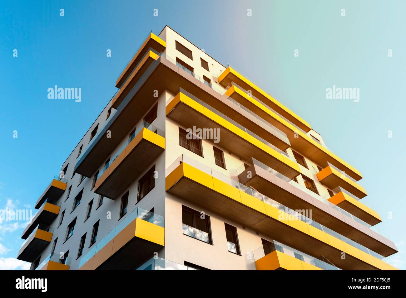 Modern apartment building with large balconies. Luxury apartments exteriors at sunny day. Apartment loan. Stock Photo