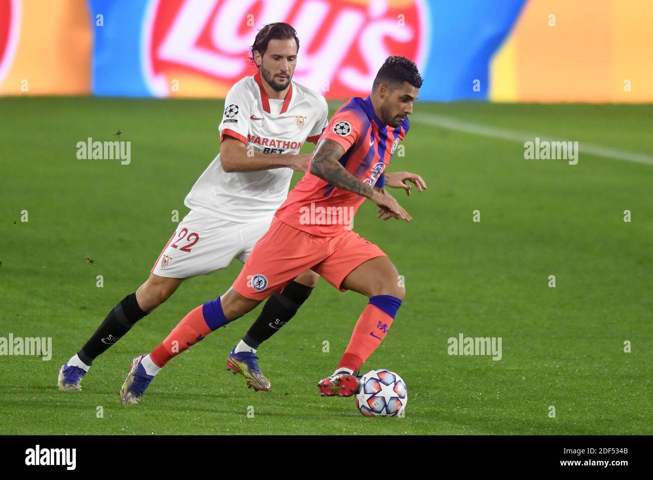 SEVILLE, SPAIN - DECEMBER 02: Franco Vazquez of FC Sevilla and Emerson of Chelsea FC during the UEFA Champions League Group E stage match between FC Sevilla and Chelsea FC at Estadio Ramon Sanchez-Pizjuan on December 2, 2020 in Seville, Spain. (Photo by Juan Jose Ubeda/MB Media) Stock Photo