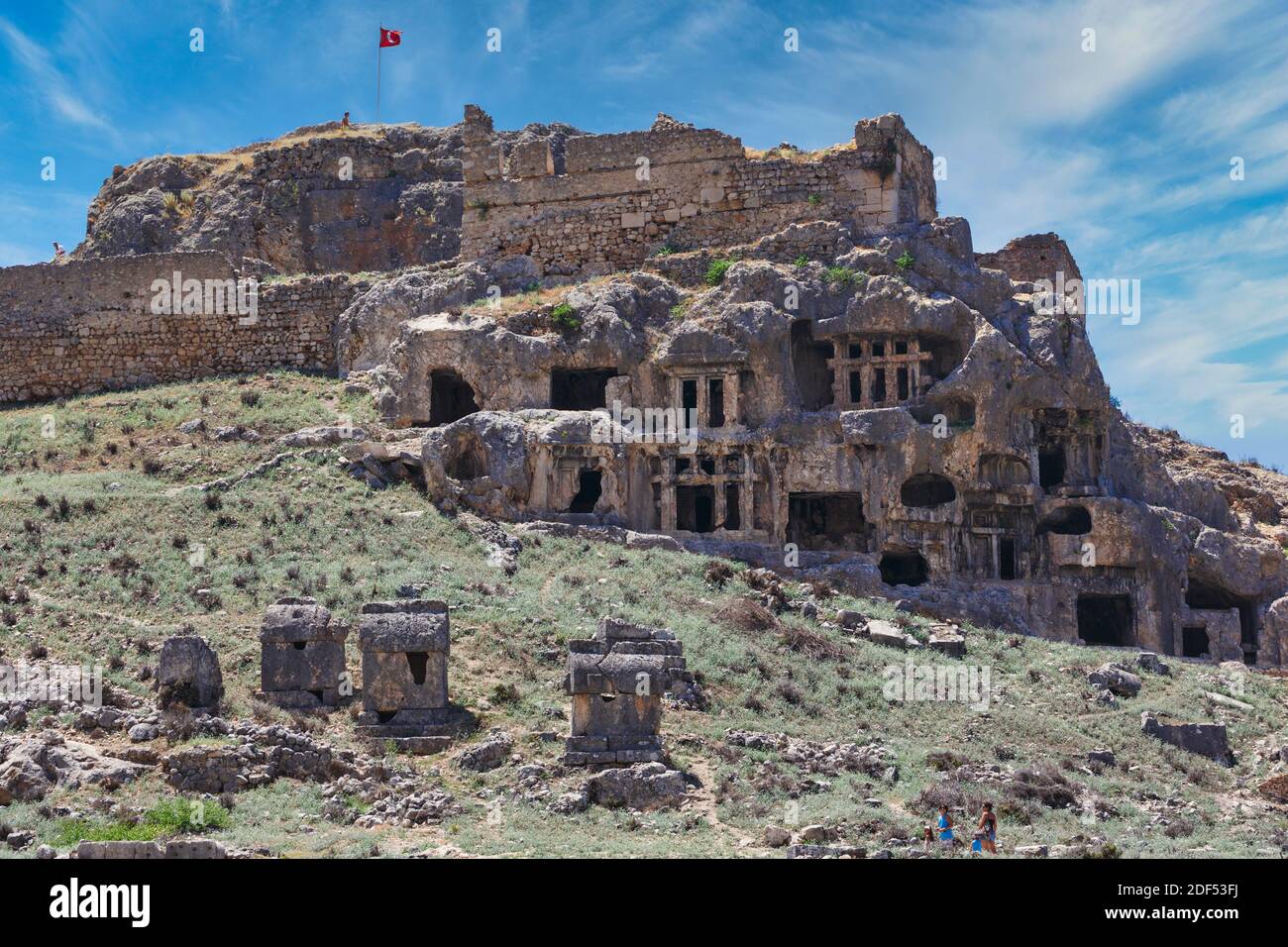 The Acropolis of the ancient Lycian city of Tlos, Antalya Province, Turkey with rock tombs below. Stock Photo