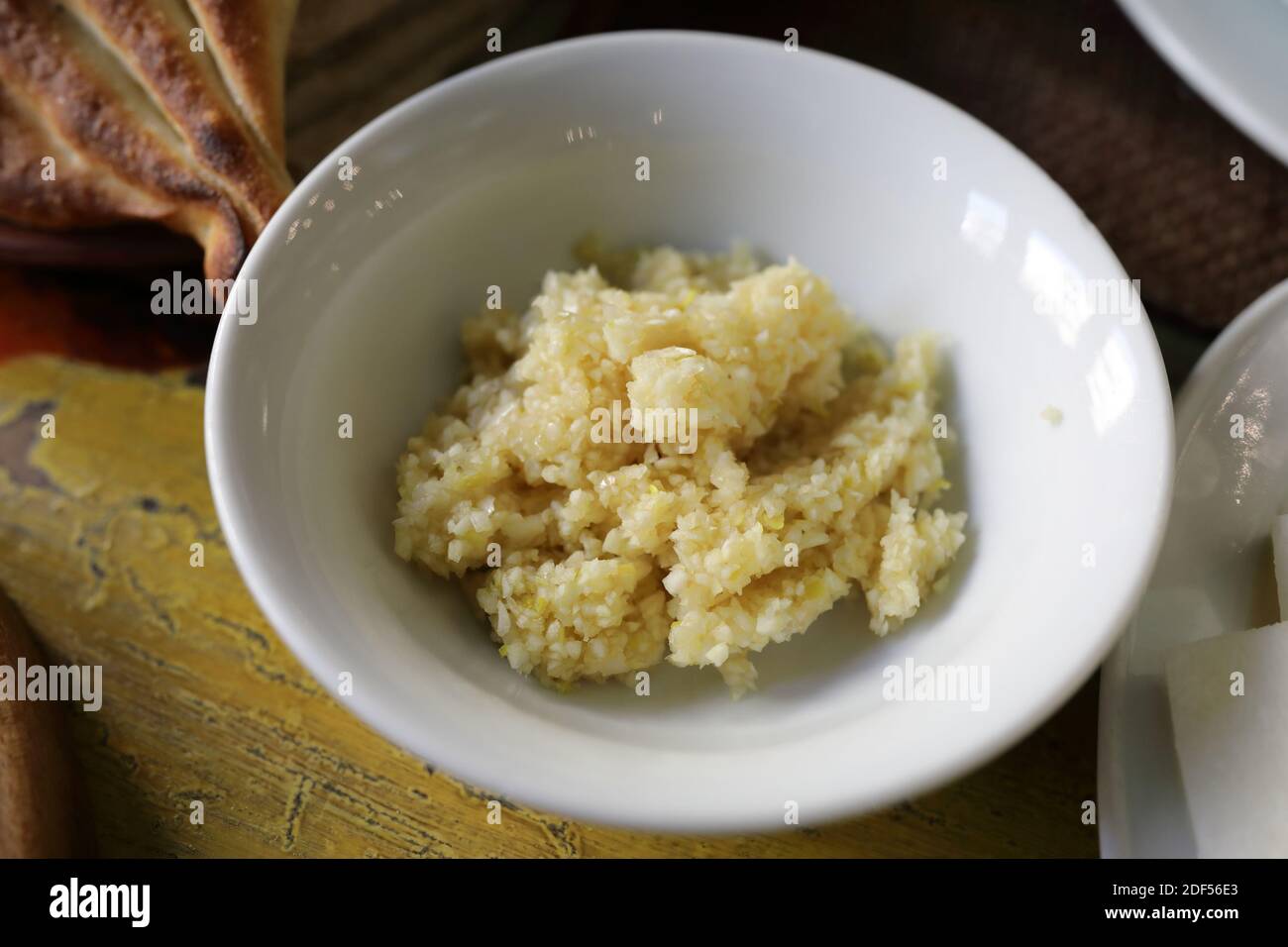 Crushed garlic for khash dish in Armenian restaurant Stock Photo Alamy