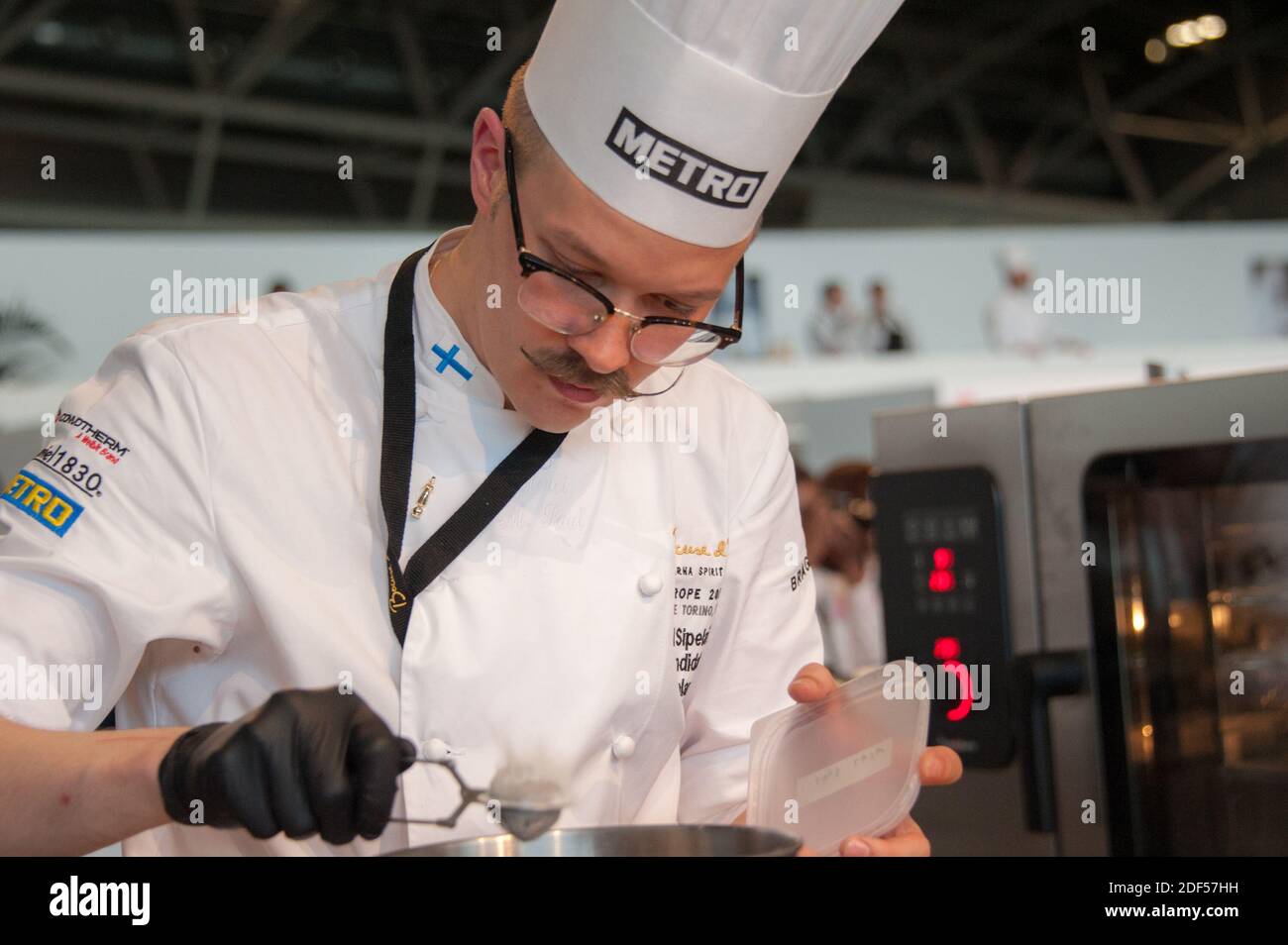 06/12/2018 Turin (Italy) Ismo Sipelainen engaged in the preparation of a refined dish during the Bocuse d'Or Stock Photo