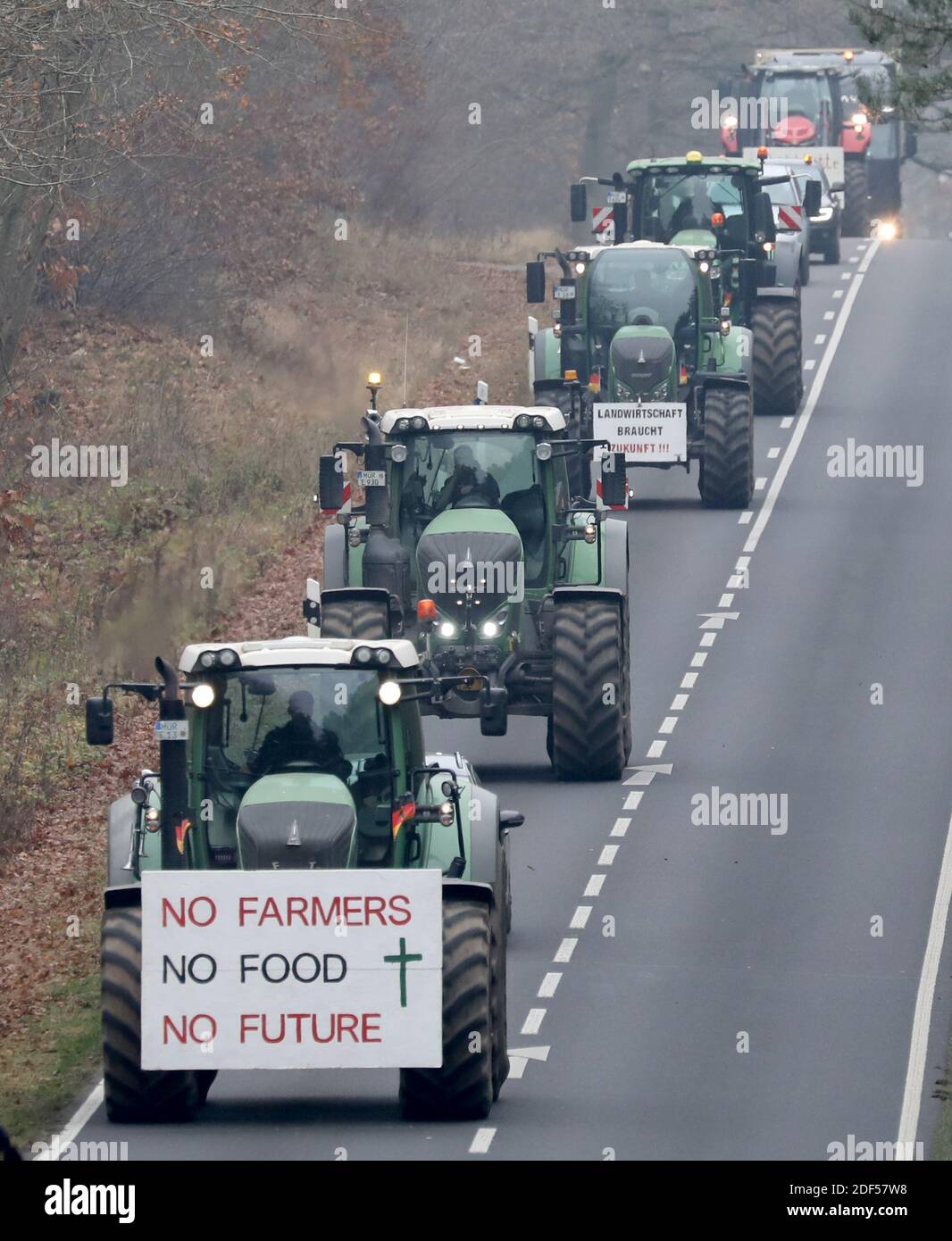 Waren, Germany. 03rd Dec, 2020. With a tractor parade to several milk and meat processors, farmers in the Mecklenburg Lake District protest against 'ruinous milk and meat prices'. A sign hangs on a tractor with the inscription 'No Farmers No Food No Future'. Credit: dpa picture alliance/Alamy Live News Stock Photo