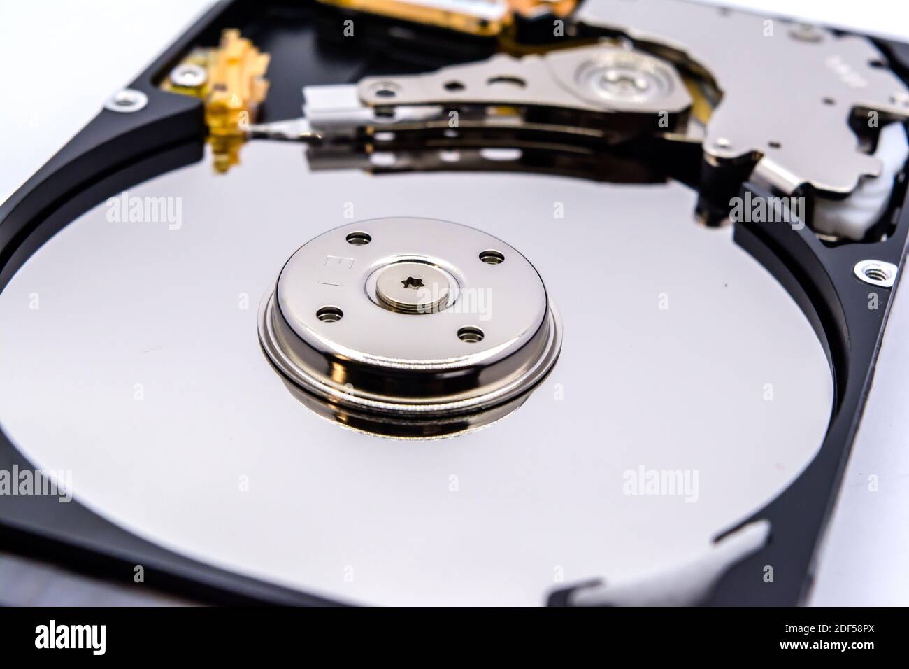 Internal parts of a hard disk isolated on a white background. Close up of Hard  disk drive inside view Stock Photo - Alamy