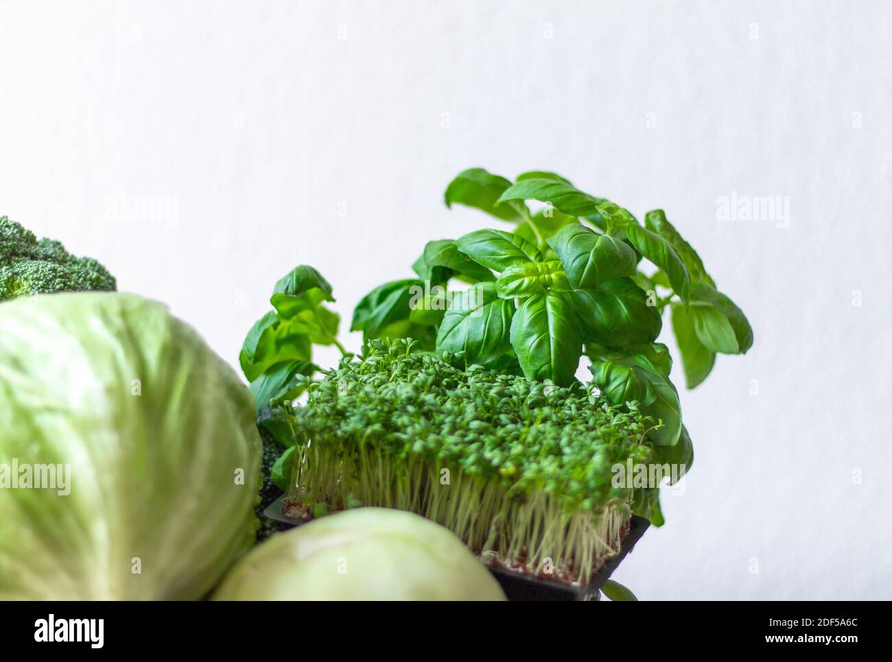 green fresh vegetables on white background Stock Photo - Alamy