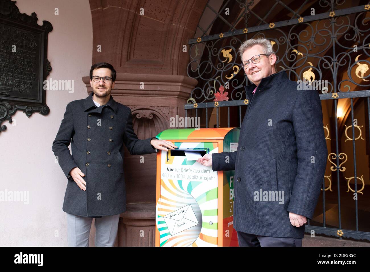 Freiburg Im Breisgau, Germany. 03rd Dec, 2020. During a press conference, the Lord Mayor of Freiburg, Martin Horn (l, non-partisan) and the Mayor of Freiburg, Ulrich von Kirchbach (SPD), stand next to a mailbox into which Freiburg citizens can drop letters to the City of Freiburg in the year 2120. The citizens are called upon to write a letter that will only be delivered in 100 years. It is about a collective legacy for posterity, texts and thoughts from the 1920s of the 21st century. Credit: Philipp von Ditfurth/dpa/Alamy Live News Stock Photo