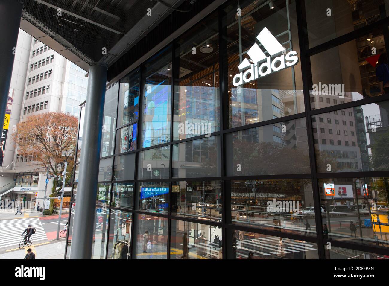 Adidas logo and store in Shibuya Stock Photo - Alamy