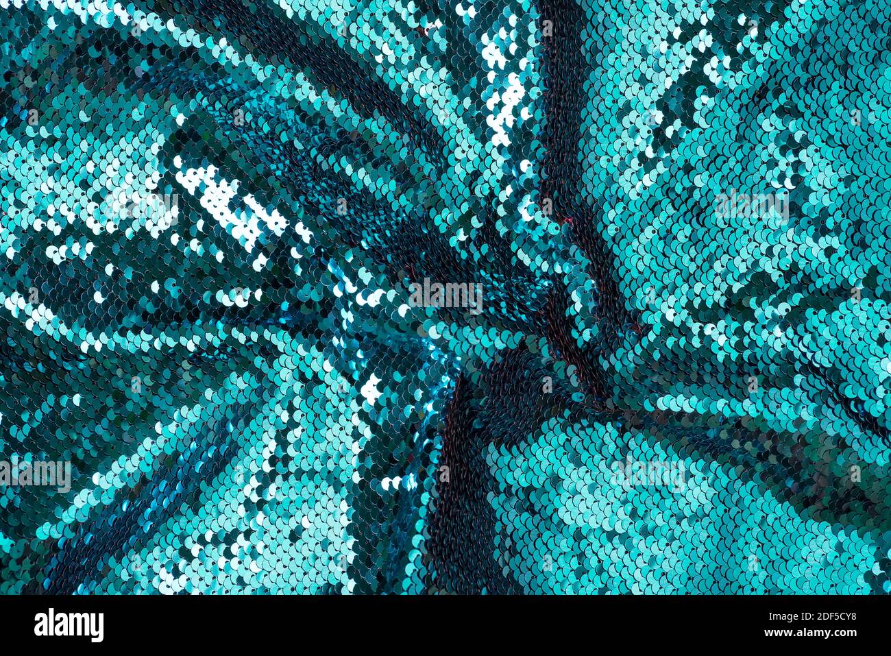 crumpled fabric sequins bleached coral glitter boke background texture Stock Photo