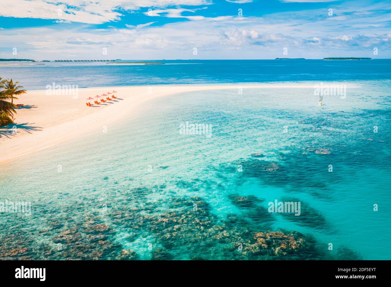 Amazing aerial landscape in Maldives islands. Perfect blue sea and coral reef view from drone or plane. Exotic summer travel and vacation landscape Stock Photo
