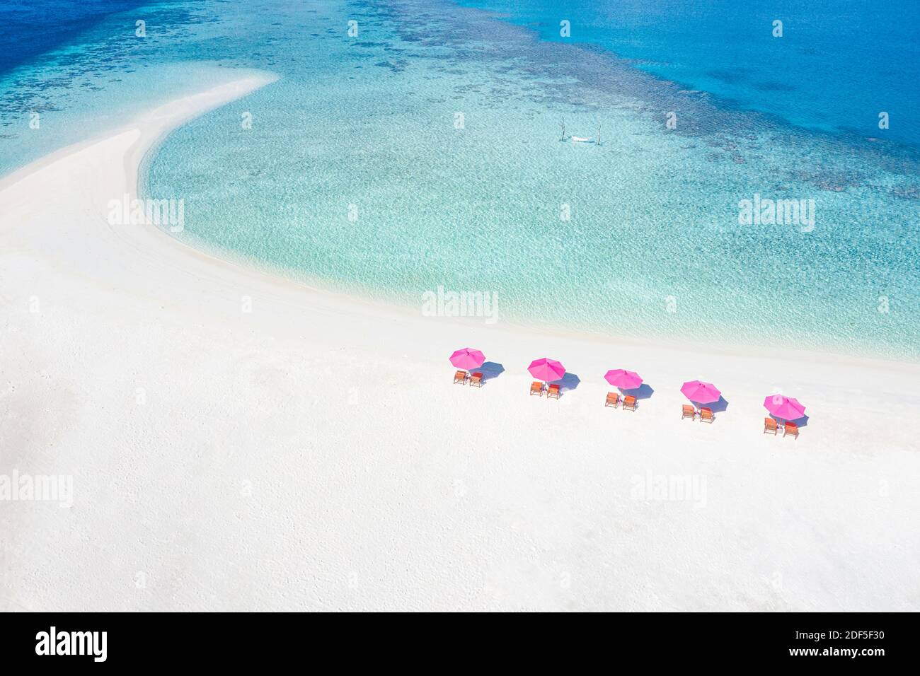 Amazing aerial landscape in Maldives islands. Perfect blue sea and coral reef view from drone or plane. Exotic summer travel and vacation landscape Stock Photo