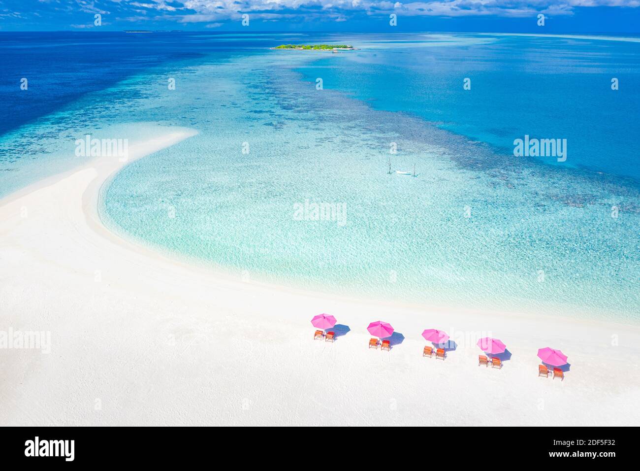 Amazing aerial landscape in Maldives islands. Perfect blue sea and coral reef view from drone or plane. Exotic summer travel and vacation landscape Stock Photo