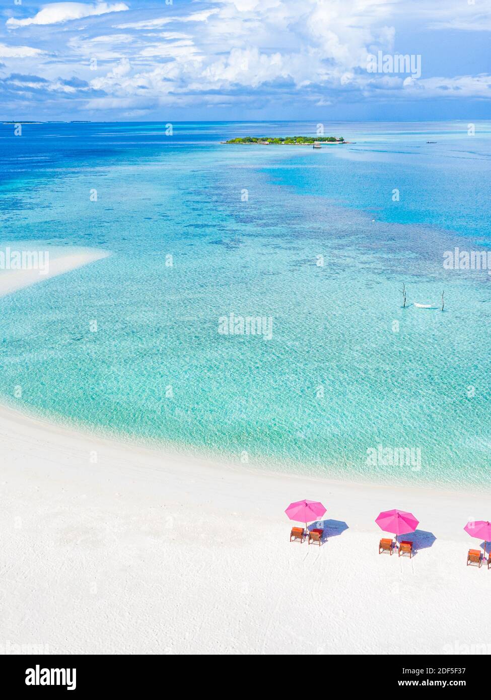Amazing aerial landscape in Maldives islands. Perfect blue sea and coral reef view from drone or plane. Exotic summer travel and vacation landscape Stock Photo