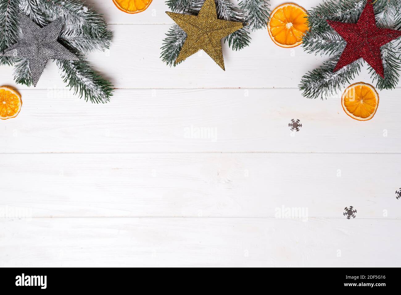 Christmas greeting card with decor and fir tree branch on a white ...