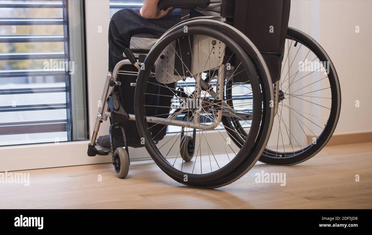 Sick man in a wheelchair hi-res stock photography and images - Alamy