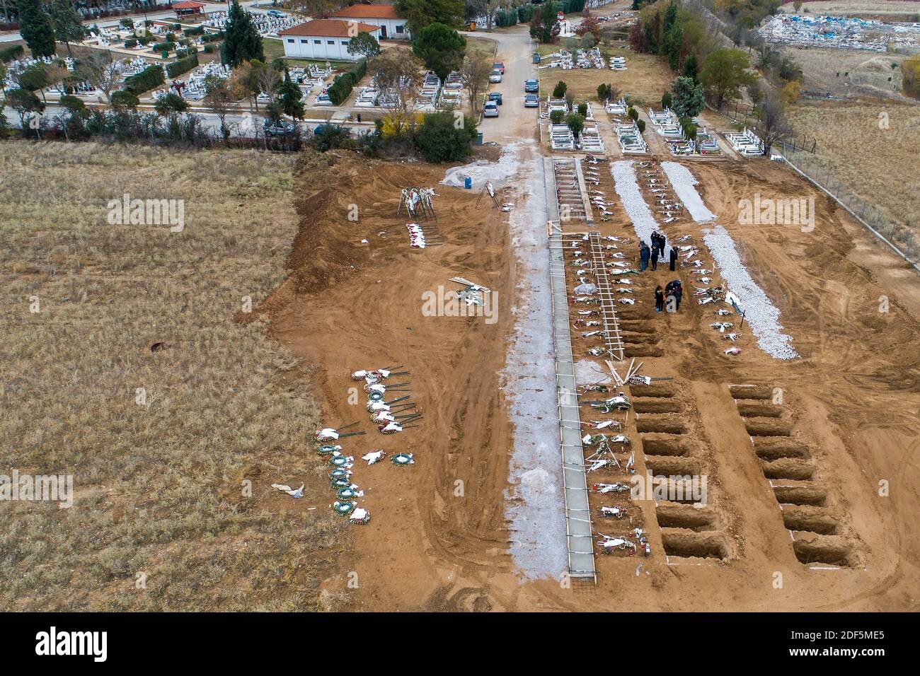 Thessaloniki, Greece - December 3, 2020: Aerial view of new graves of Covid-19 victims in a cemetery in Evosmos, Thessaloniki Stock Photo