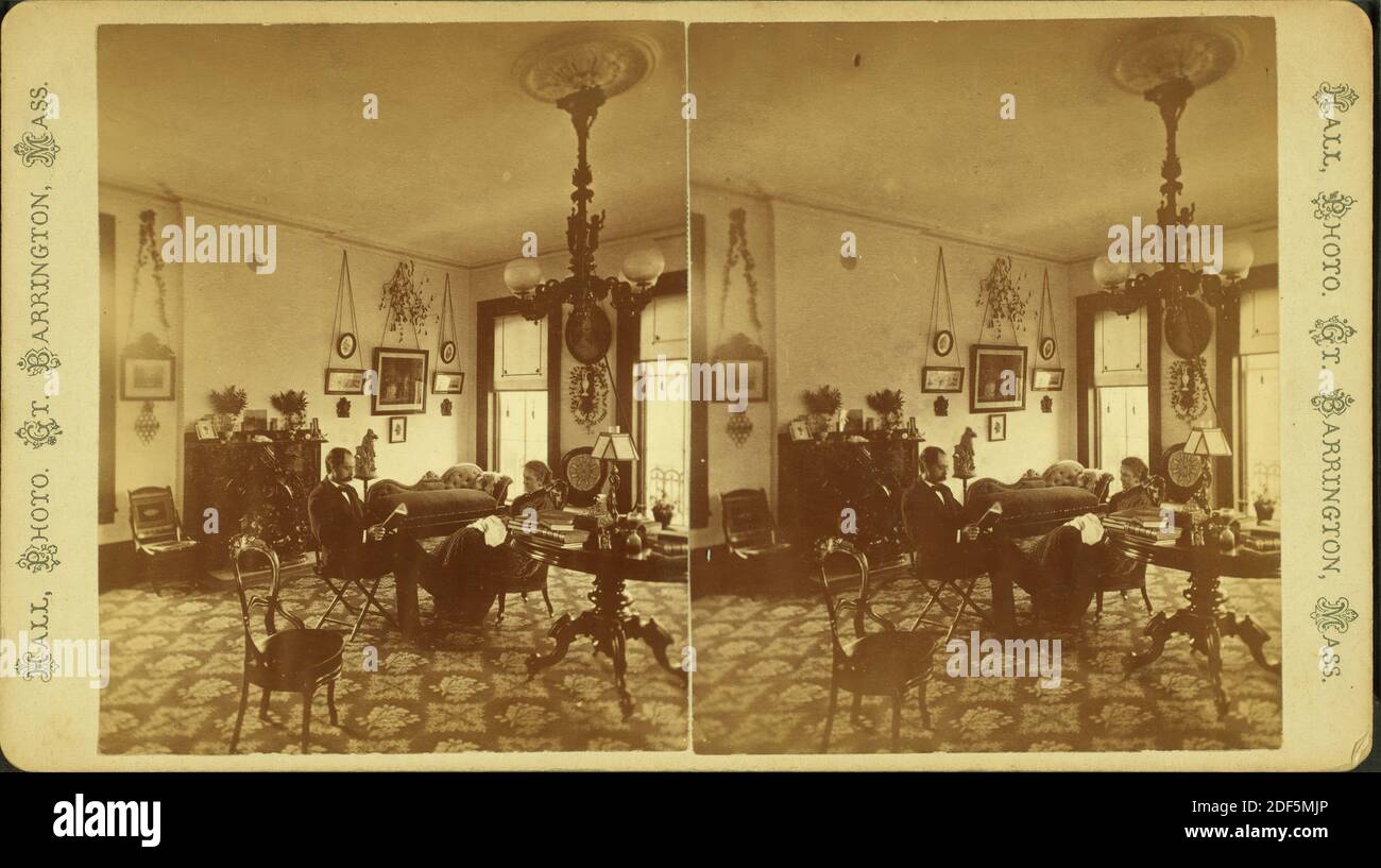 Mr. & Mrs. Marcus H. Rogers in their parlor on the 2nd floor of the 'Berkshire Courier' building, furniture, light fixtures, layout of rooms visible., still image, Stereographs, 1850 - 1930, Hall, J. (Julius) (b. 1844 Stock Photo