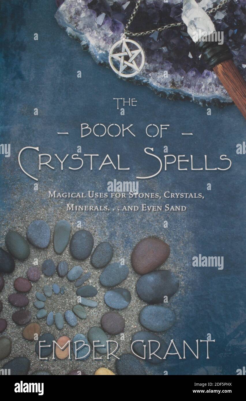 The book of crystal spells by Ember Grant Stock Photo