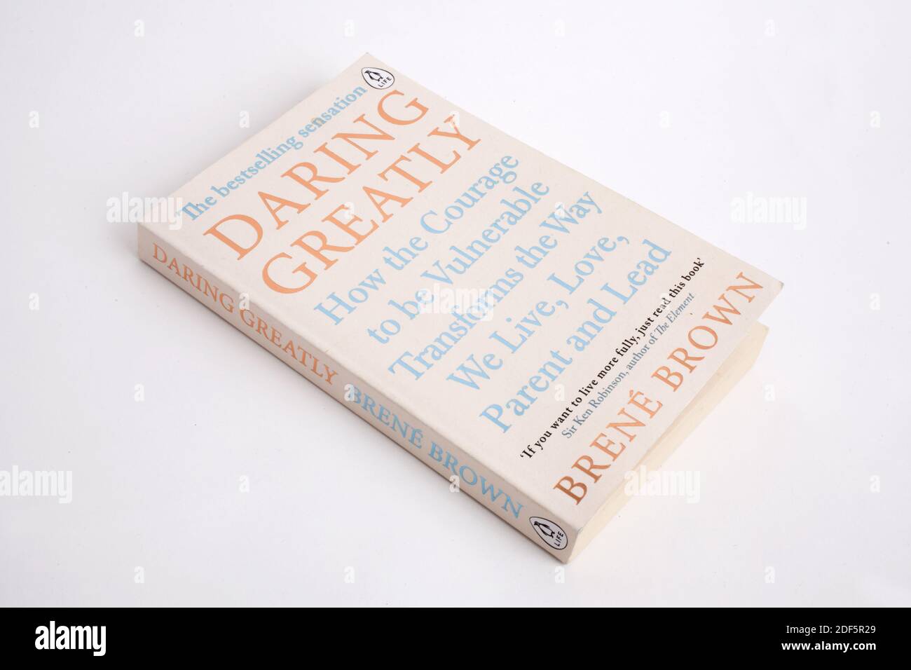 The book, Daring Greatly by Brene Brown , photographed against a studio background Stock Photo