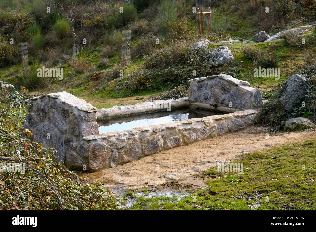 An old watering hole on the route of the chestnut trees, in Rozas de Puerto Real, in the Community of Madrid Stock Photo