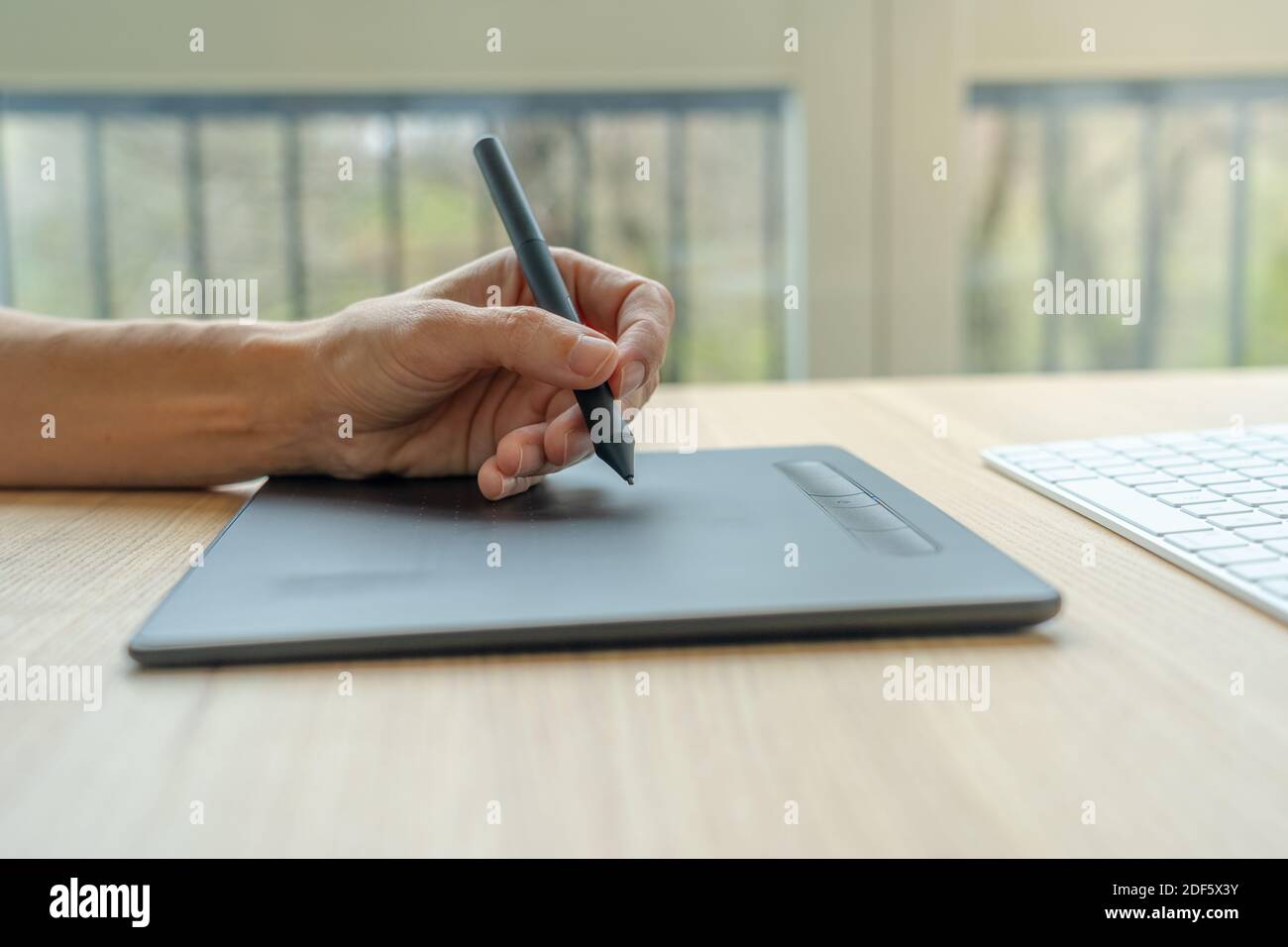 Video artist using graphics tablet. Stock Photo