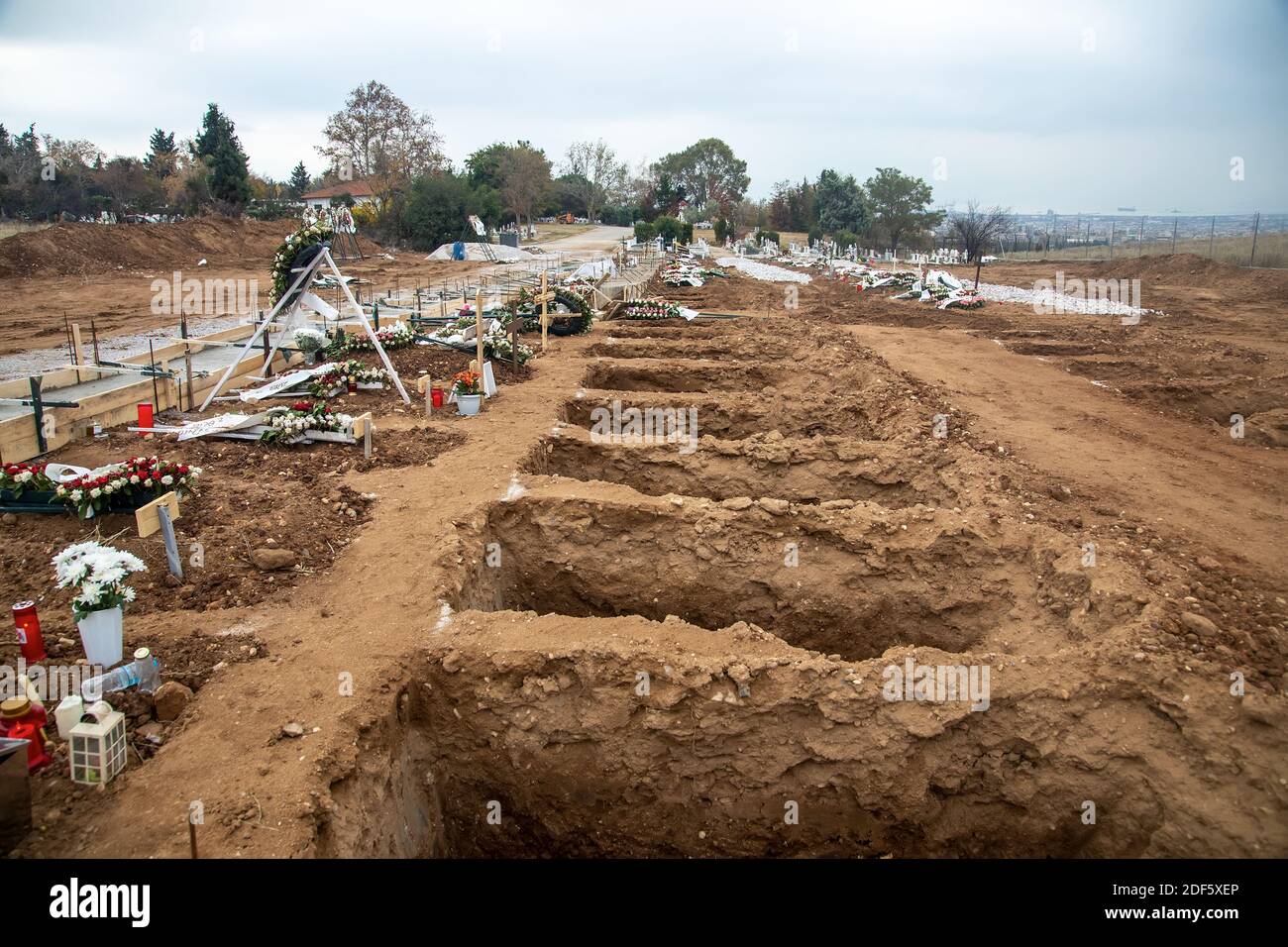 Thessaloniki, Greece - December 3, 2020: Tens new graves of Covid-19 victims in a cemetery in Evosmos, Thessaloniki Stock Photo