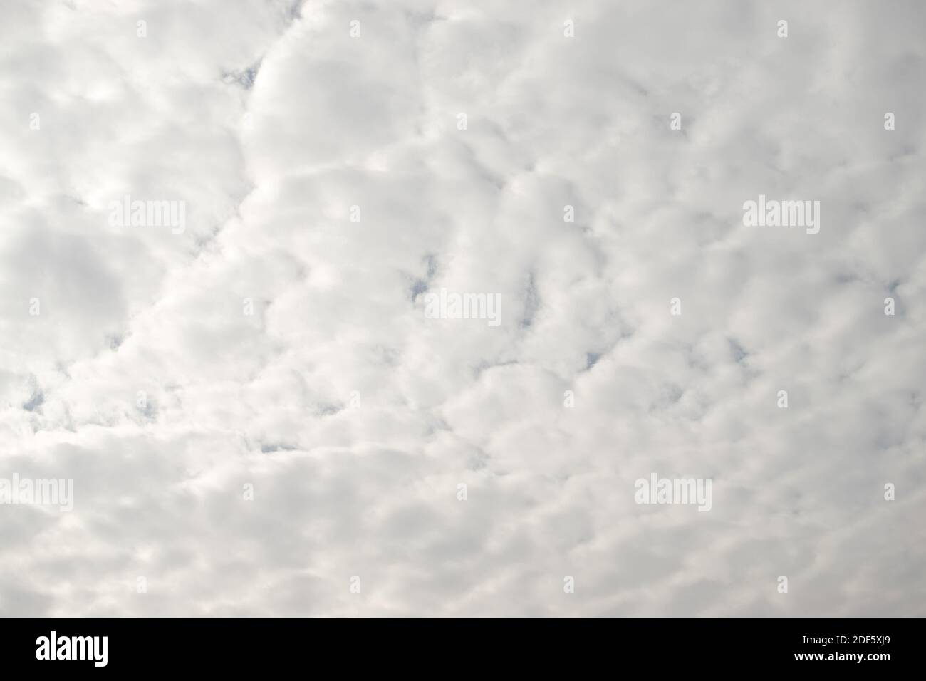 White fluffy clouds in the sky, background and texture Stock Photo