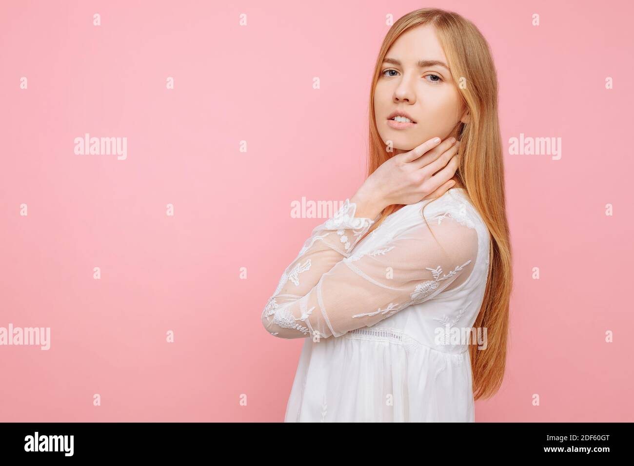 Portrait of a cute beautiful girl in white dress Stock Photo - Alamy