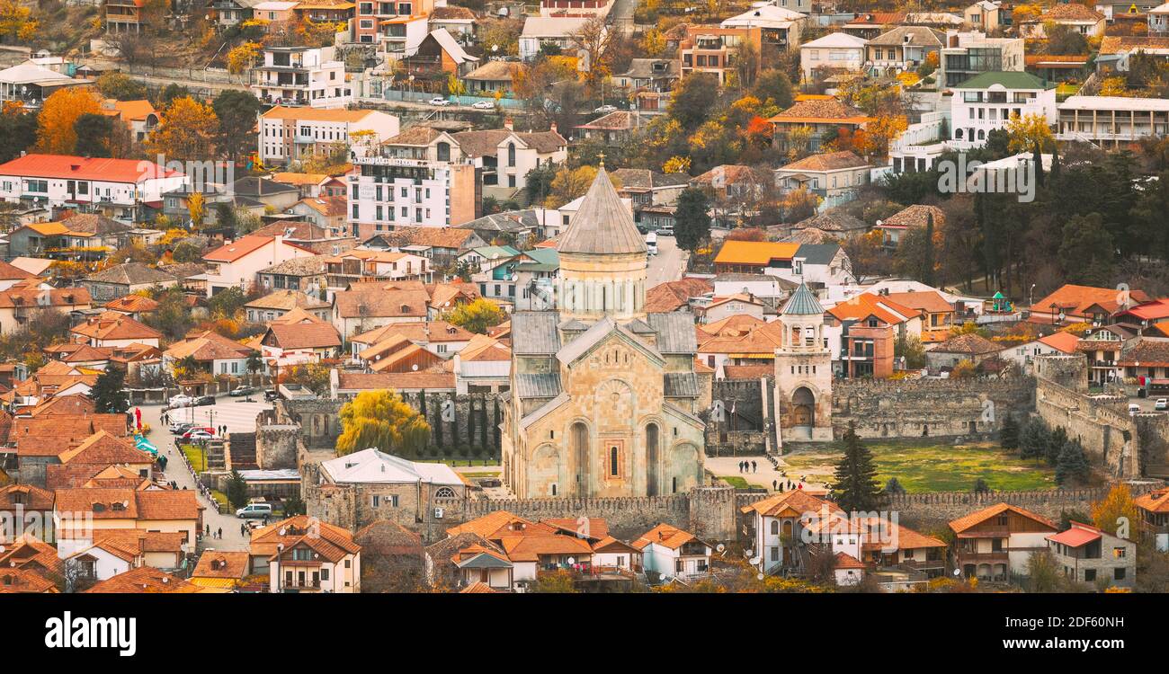 Mtskheta Georgia. Top Rooftop View Of Ancient Town And Svetitskhoveli Cathedral During Autumn Day. UNESCO World Heritage Site Stock Photo