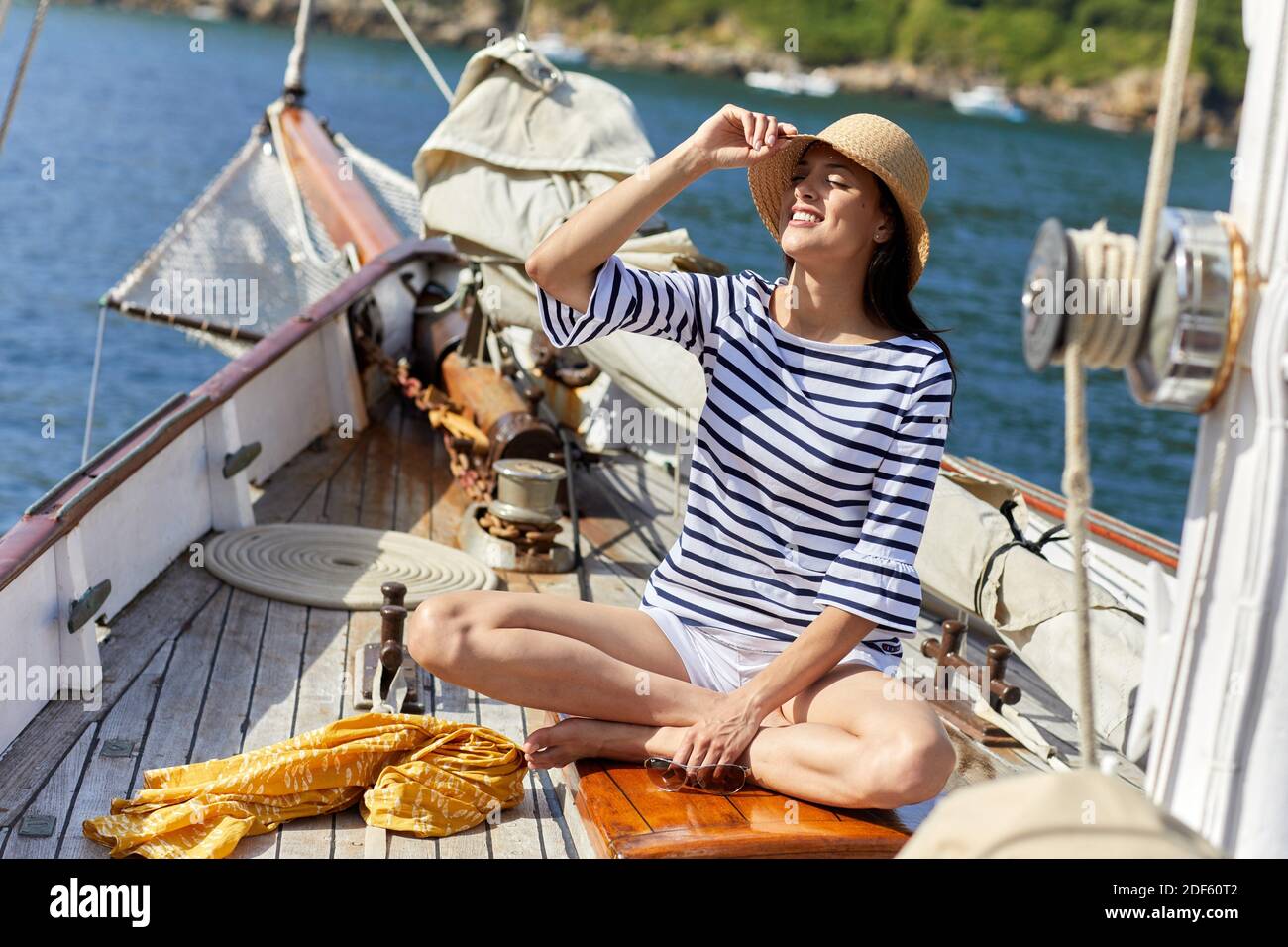 Young woman with sailor clothes, Sailing boat, Pasaia port, Gipuzkoa, Basque Country, Spain, Europe Stock Photo