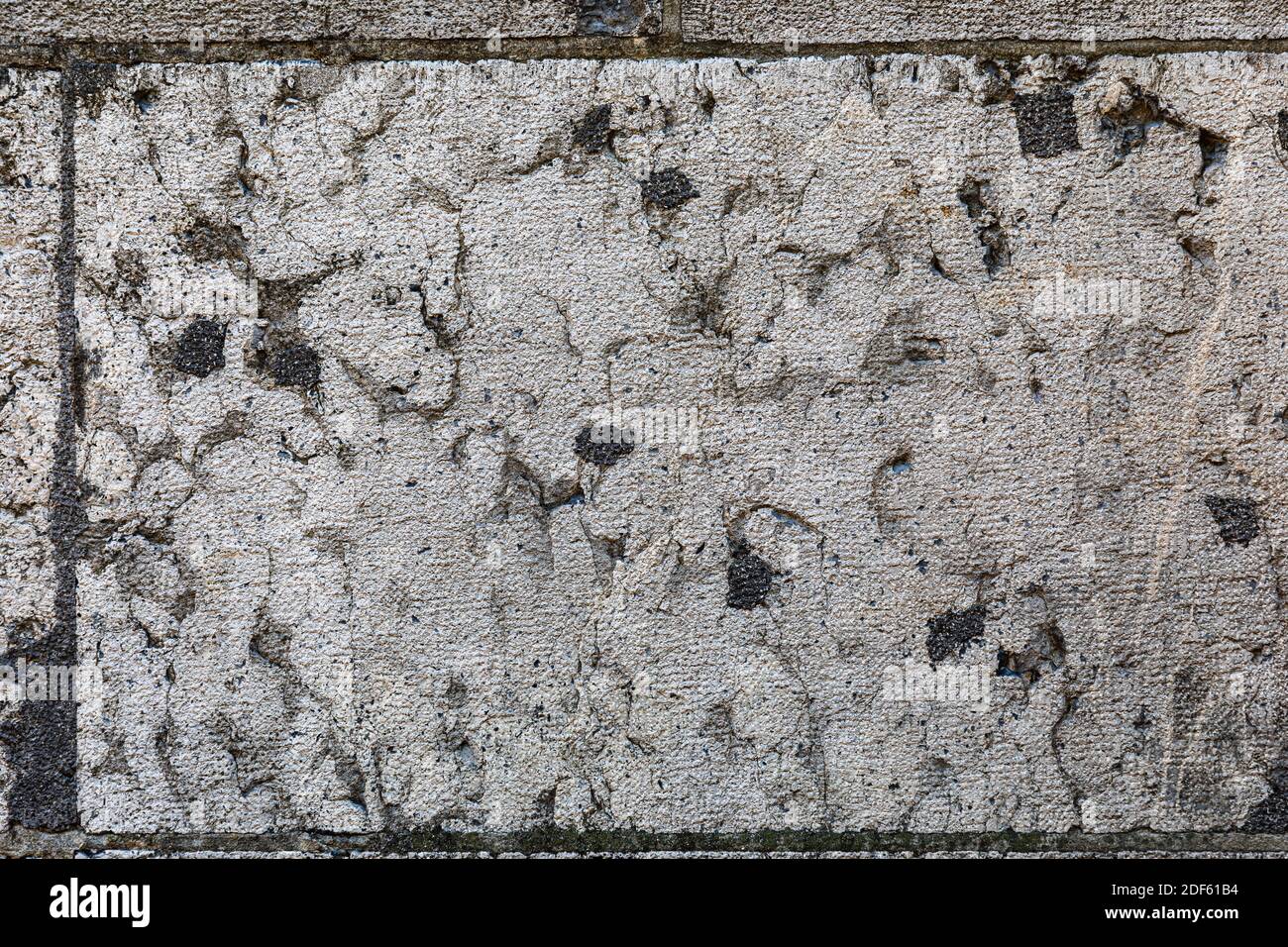 natural patterns on old sandstone wall taken in the old city of bern switzerland. Stock Photo