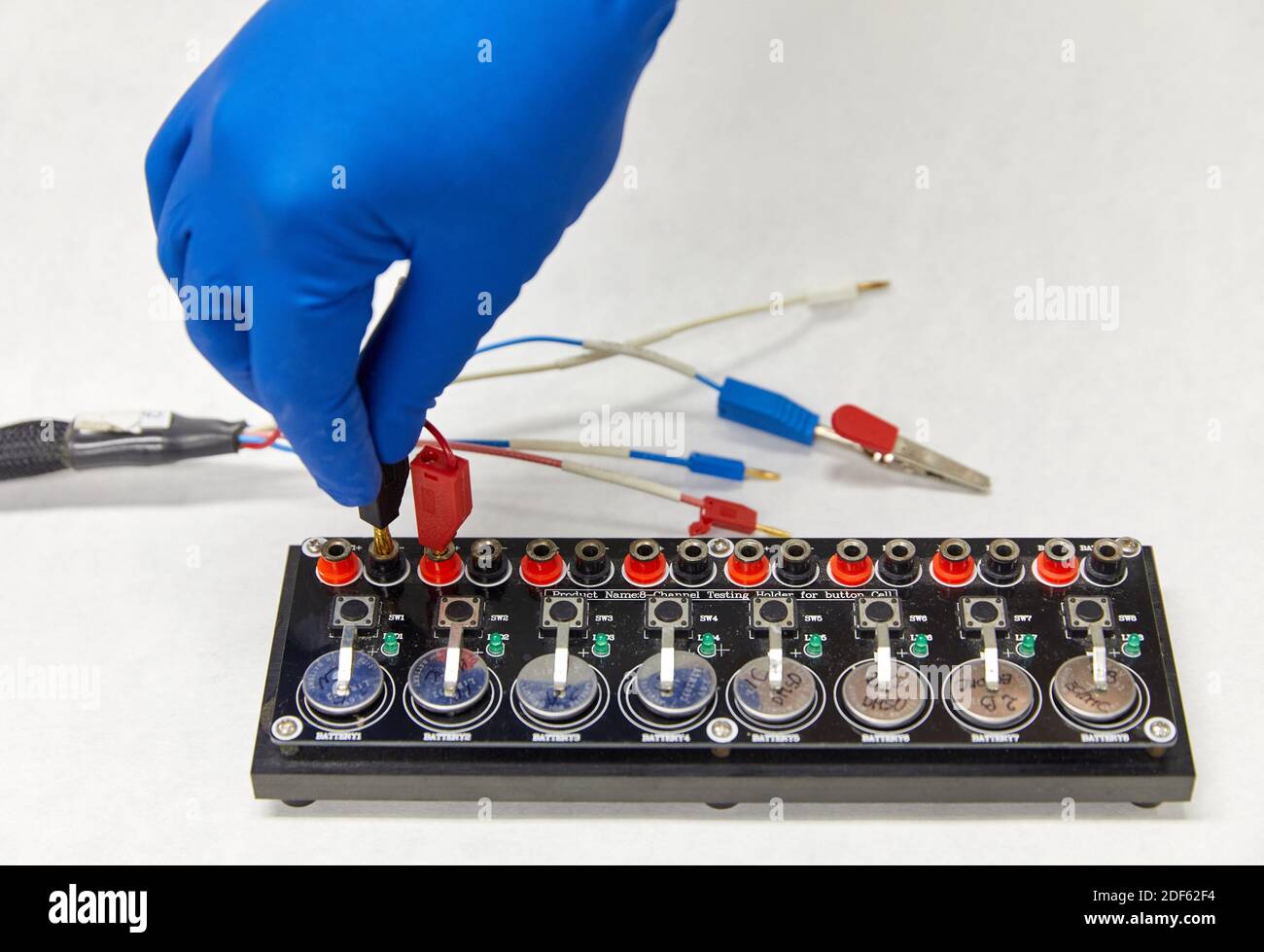 Button battery test, Energy laboratory Stock Photo Alamy