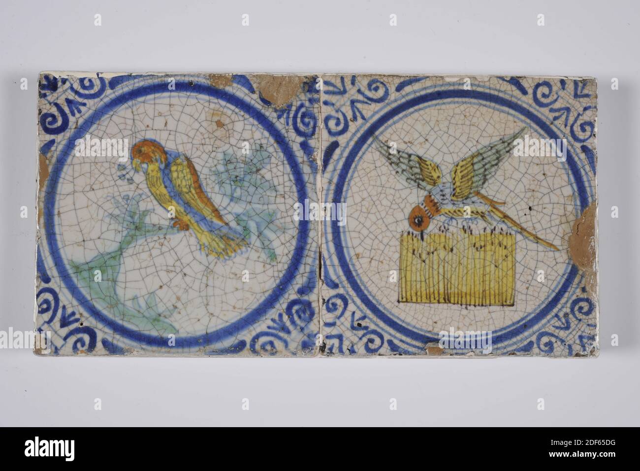 tile field, Anonymous, between 1620 - 1650, tin glaze, pottery, With frame: 16 x 54.7 x 3.6cm (160 x 547 x 36mm), bird, Tile field of four tiles (one by four) of earthenware covered with tin glaze. Multicolor painted in blue, green and orange. On each tile is a bird centered to the left, always on a light green ground with an orange spot and a light green branch. The birds from left to right: 1: profile profiled to the left in blue, orange and green, 2: profile profiled to the left with a long neck, head turned to the right, 3: profile profiled to the left in blue, orange and green, with short Stock Photo